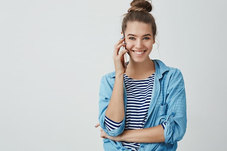 happy-excited-attractive-young-woman-talking-by-phone-min